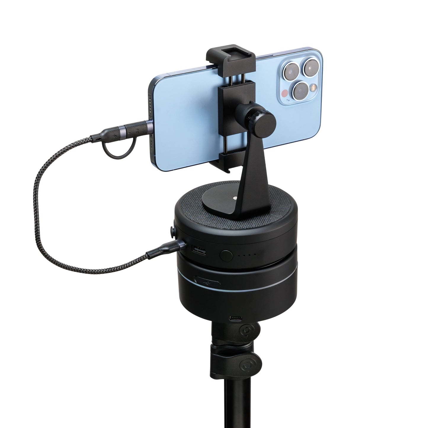 Portable power bank fast charger with dual USB ports charging a smartphone on a stand